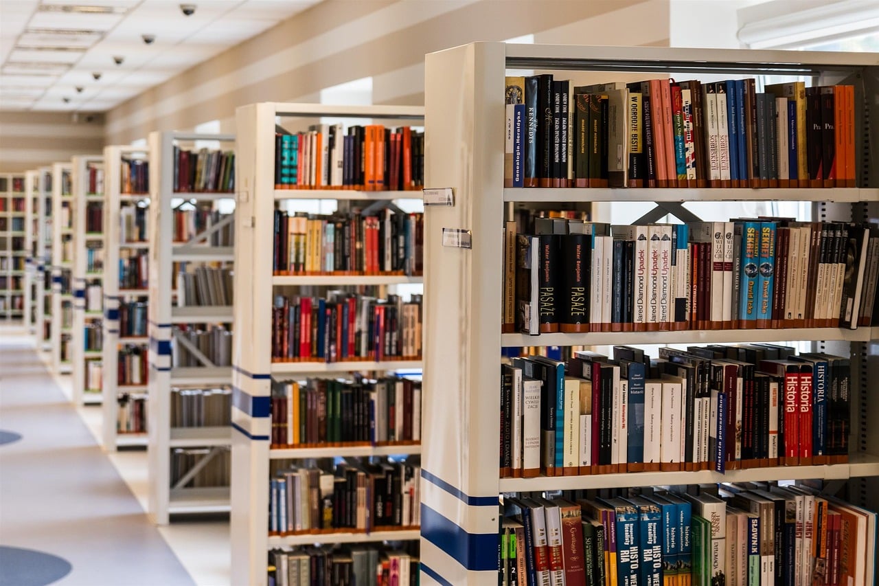 A library with rows of book shelves.