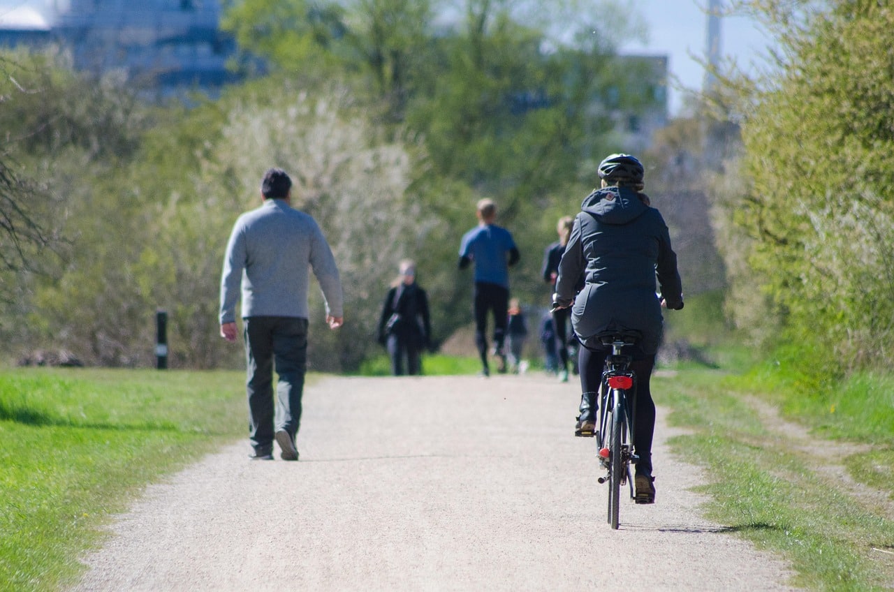 People walking and cycling on pathway