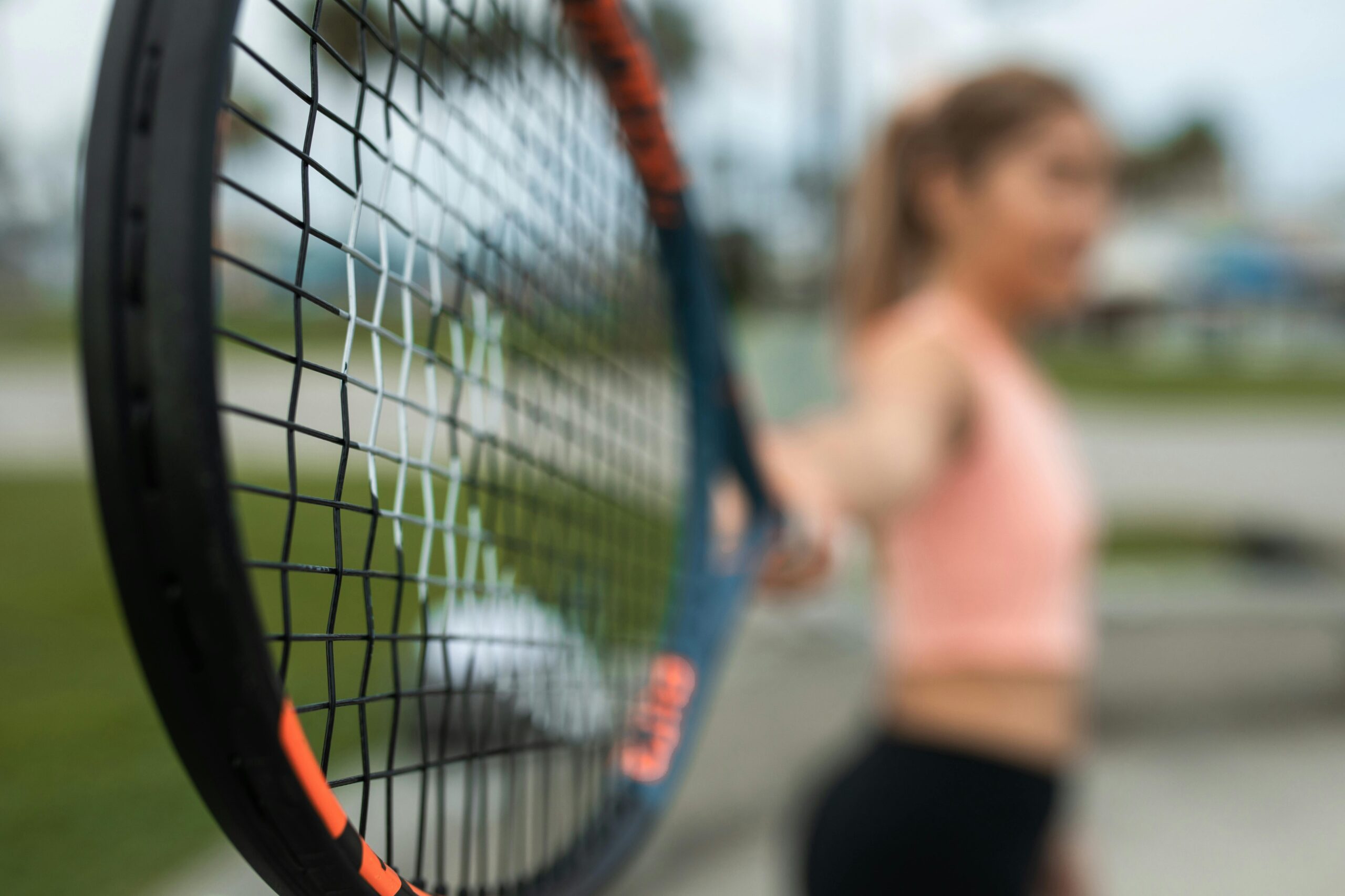 Closeup of a tennis racket.