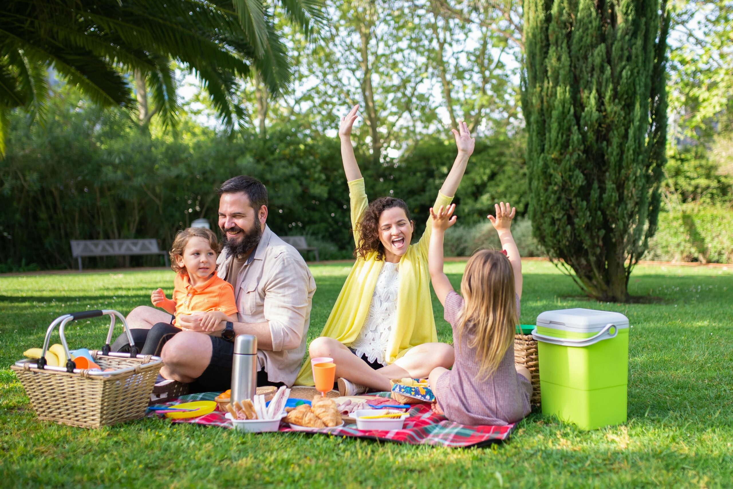 Family having a picnic at the park.