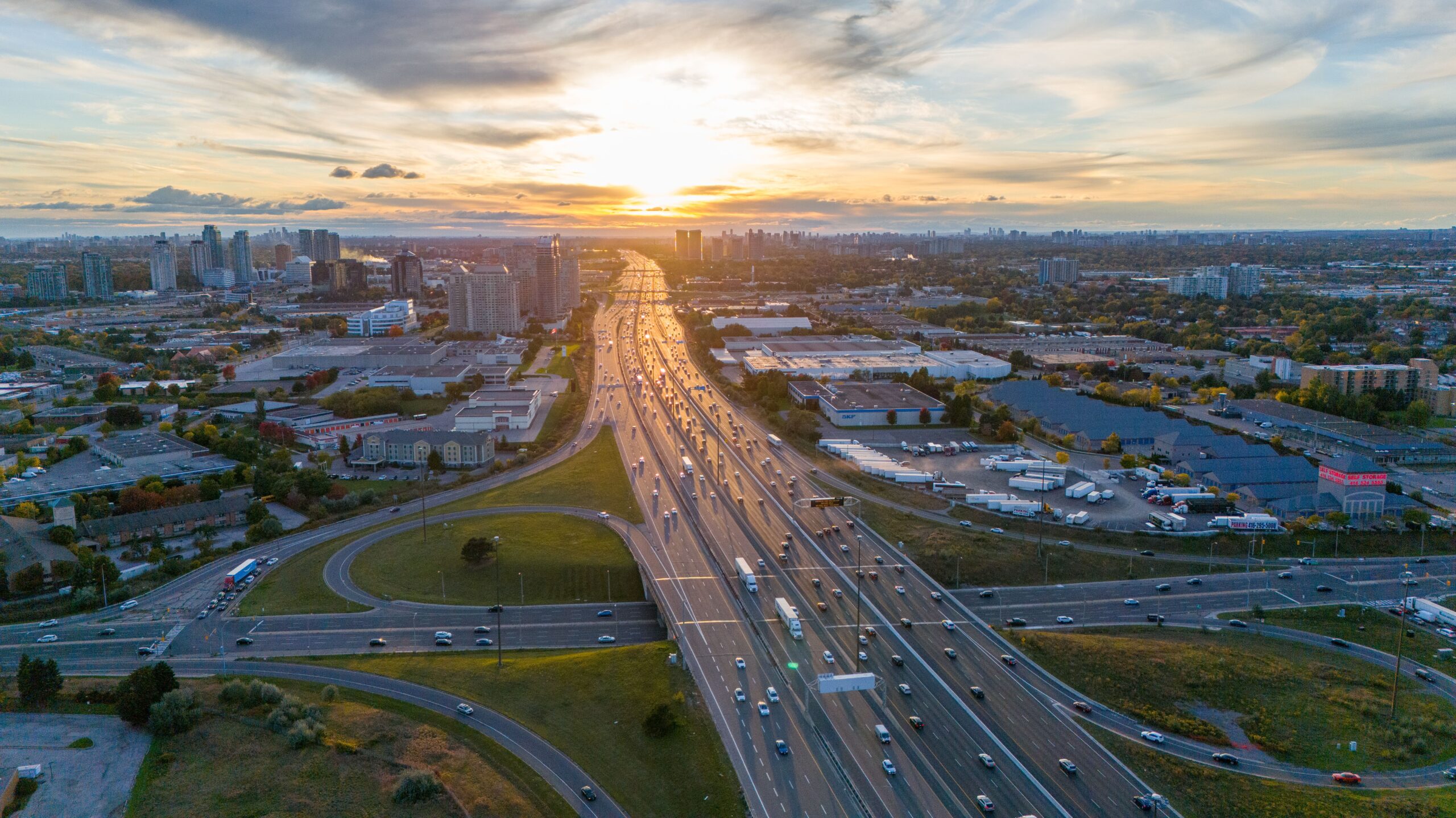 A highway in Toronto during a sunset.