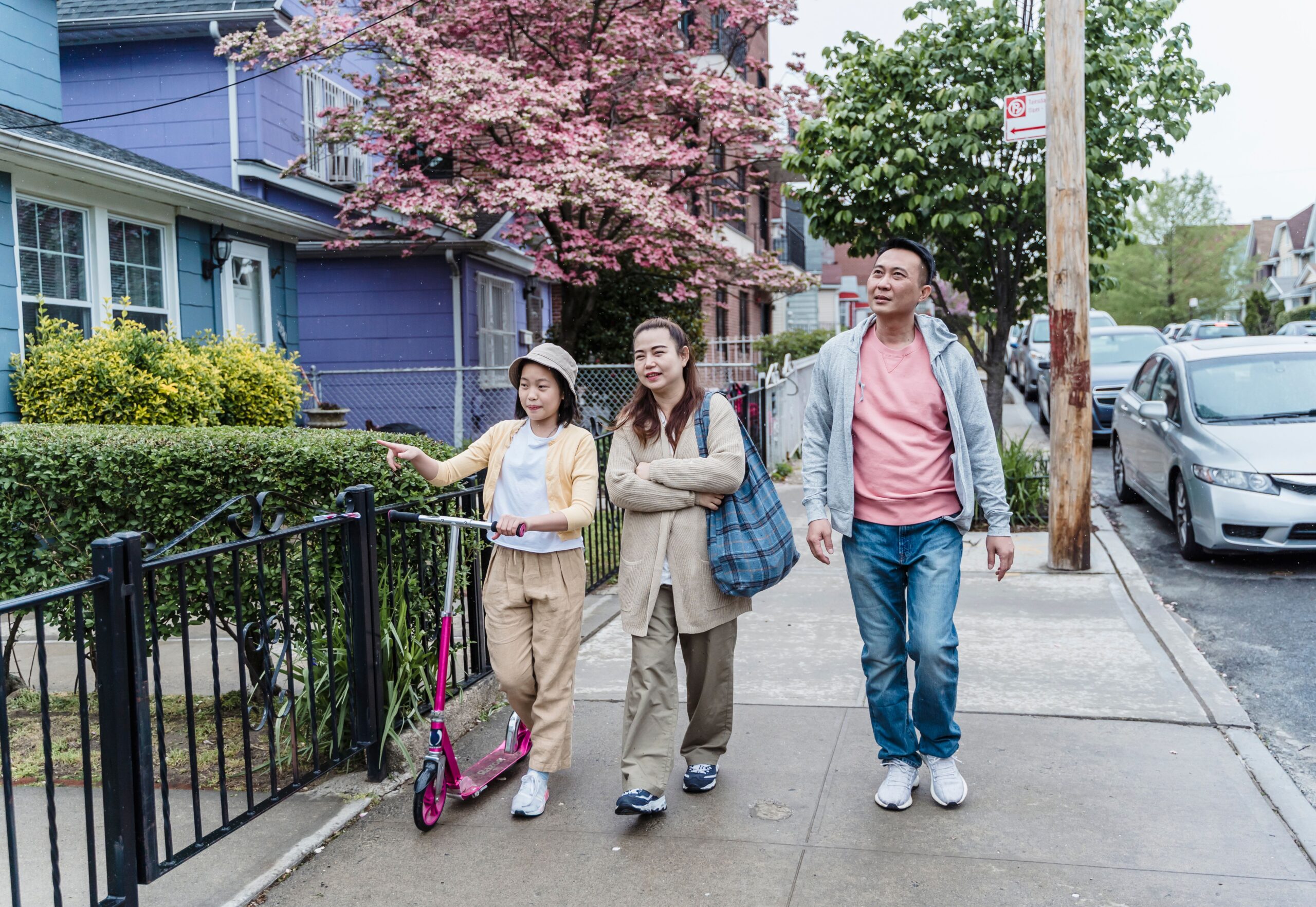 Family walking in a neighbourhood.