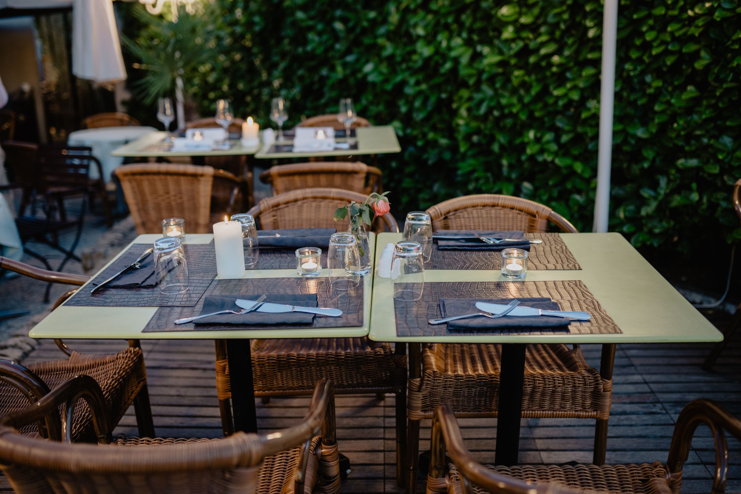 Dining tables outside on a patio.