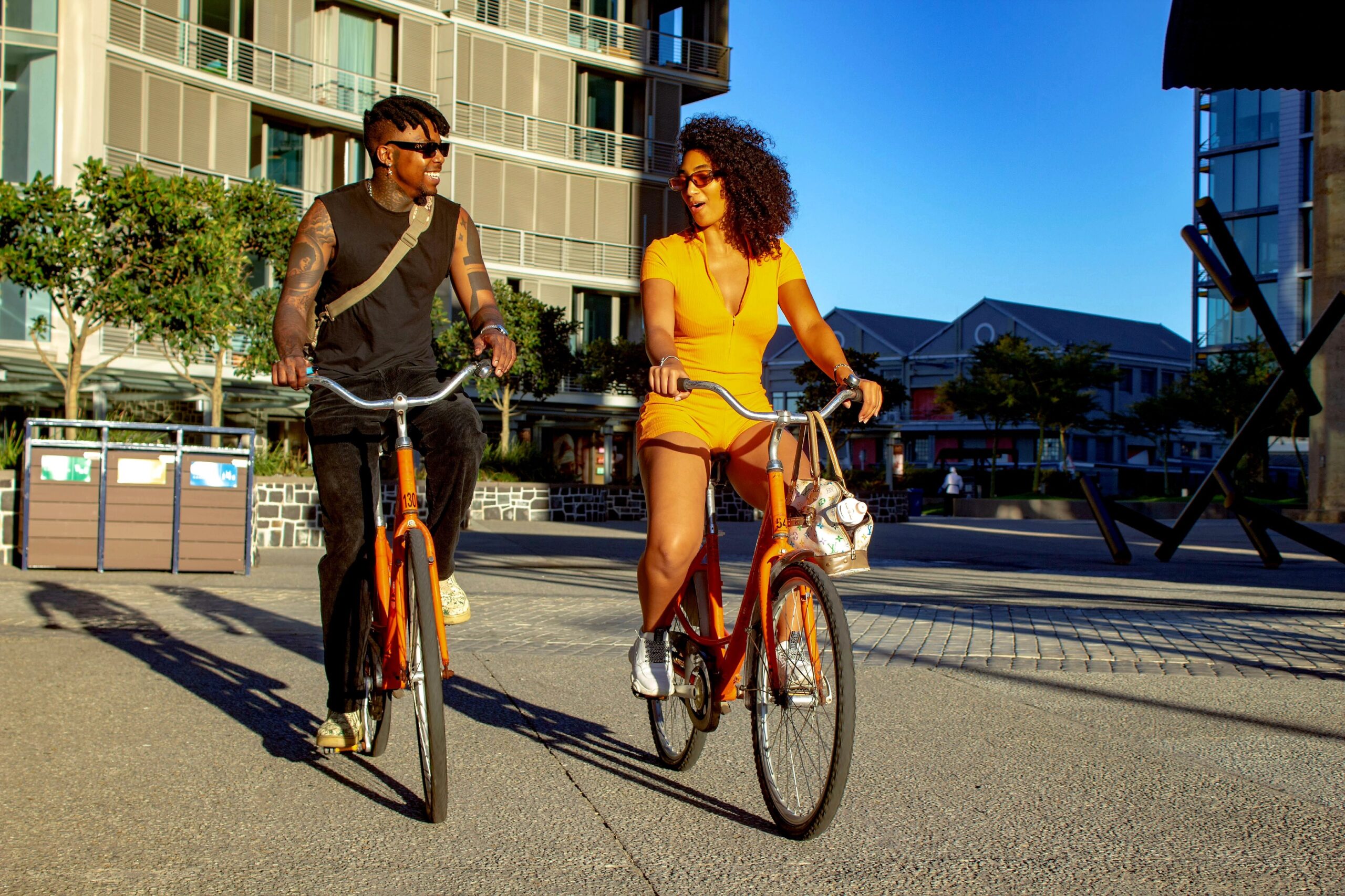 Two people cycling side by side.